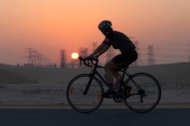 Bike enthusiasts head to al-Qudra cycling track, some 50 kilometres (about 30 miles) from the city centre as riders leave behind highways and skyscrapers to hit an 80-kilometre trail. (AFP)