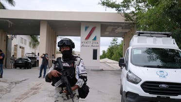 Government forces guard the entrance of hotel after an armed confrontation near Puerto Morelos, Mexico, Thursday, November 4, 2021. (AP)