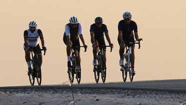 Bike enthusiasts head to al-Qudra cycling track, some 50 kilometres (about 30 miles) from the city centre as riders leave behind highways and skyscrapers to hit an 80-kilometre trail. (AFP)