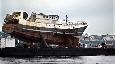 The wreck of French trawler Bugaled Breizh is brought back into the French harbour of Brest, July 13, 2004. The Bugaled Breizh which sank in January off the coast of southwest England killing five crew members, will be taken to a military base where experts will be able to inspect it. (File photo: Reuters)