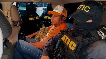 Technical Agency for Criminal Investigation escorting Honduras' presidential candidate for the Movimiento Independiente Dignidad y Esperanza, ex-military captain Santos Rodriguez Orellana (C) in Tegucigalpa on November 4, 2021. (AFP)