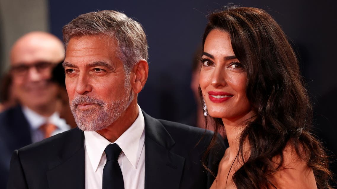 Director George Clooney and his wife lawyer Amal Clooney arrive for a screening of the film The Tender Bar as part of the BFI London Film Festival, in London, Britain, October 10, 2021. REUTERS/Henry Nicholls