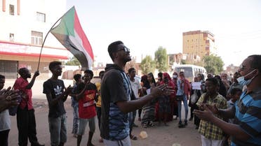 People chant slogans during a protest in Khartoum, amid ongoing demonstrations against a military takeover in Khartoum, Sudan, Thursday, Nov. 4, 2021. (AP)