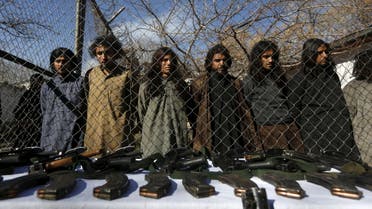 Pakistani Taliban fighters, who were arrested by Afghan border police, stand during a presentation of seized weapons and equipment to the media in Kabul, Afghanistan January 5, 2016. REUTERS/Omar Sobhani TPX IMAGES OF THE DAY
