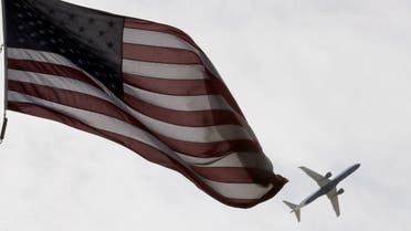A Delta Airlines flight takes off past a U.S. flag in Boston, Massachusetts, US, May 27, 2021. (File photo: Reuters)