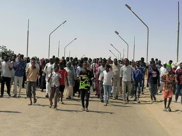  Sudanese demonstrators march and chant during a protest against the military takeover, in Atbara, Sudan October 27, 2021 in this social media image. (Reuters)
