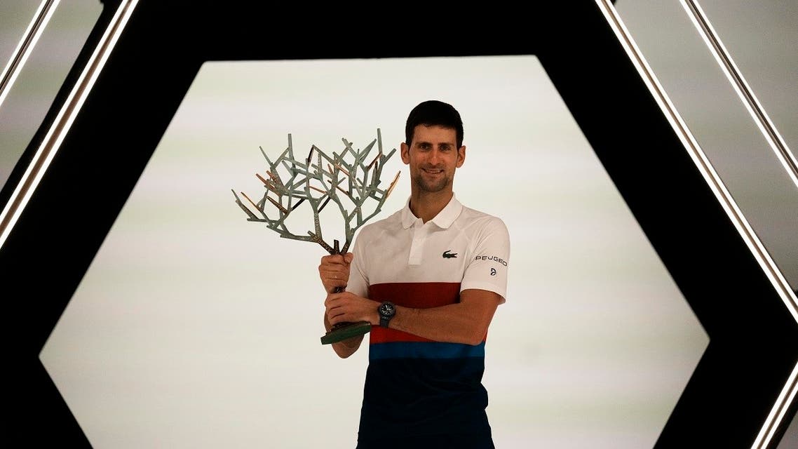 Serbia’s Novak Djokovic poses with his trophy after defeating Russia’s Daniil Medvedev in the final match of the Paris Masters tennis tournament at the Accor Arena in Paris, on Nov.7, 2021. (AP)