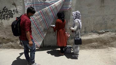 Health workers go door to door during a polio vaccination campaign in the old part of Kabul, Afghanistan, on June 15, 2021. (AP)