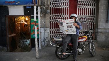 A man reads a newspaper, the day after the presidential election, in Tehran, Iran, May 20, 2017. (TIMA via Reuters)
