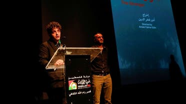 Syrian screenwriter and director Ameer Fakher Eldin speaks during the opening of the Palestine Cinema Days festival, in Ramallah in the Israeli-occupied West Bank, November 3, 2021. (Reuters/Mohamad Torokman)