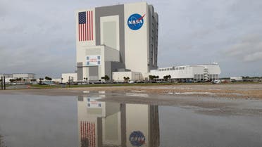 The massive Vehicle Assembly Building where NASA’s powerful new 322-foot-tall moon rocket has been assembled for the unpiloted Artemis 1 mission, is reflected after a hard rain at the Kennedy Space Center in Cape Canaveral, Florida, U.S. October 28, 2021. REUTERS/Thom Baur