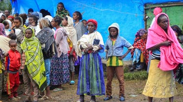 Displaced Amharas from different villages now controlled by Tigrayan forces in the North Gondar zone, gather in a kindergarten school housing the internally-displaced, in Debark, in the Amhara region of northern Ethiopia. (AP)