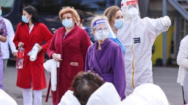 Medical personnel assist the people evacuated after a fire broke out at the intensive care unit of a COVID-19 hospital in Constanta, Romania, October 1, 2021. (File photo: Reuters)