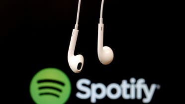 Hadphones are seen in front of a logo of online music streaming service Spotify in this illustration picture taken in Strasbourg, February 18, 2014. (File Photo: Reuters)