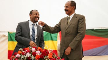 Eritrea's President Isaias Afwerki receives a key from Ethiopia's PM Abiy Ahmed to mark the reopening of the Eritrean Embassy in Addis Ababa. (File Photo: Reuters)