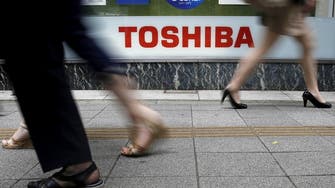 Toshiba to split into three units after pressure from activists