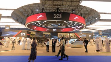 Visitors walk past the Edge display during the Dubai Airshow in Dubai, United Arab Emirates, November 14, 2021. (Reuters)