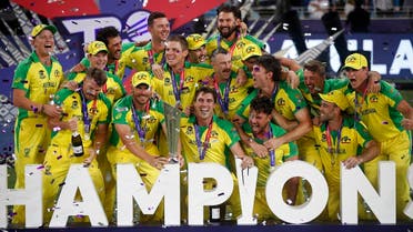 Australia captain Aaron Finch celebrates with the trophy and teammates after winning the ICC Men's T20 World Cup. (Reuters)