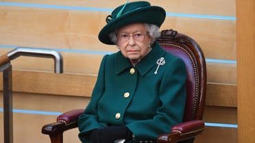 In this file photo taken on October 02, 2021 Britain's Queen Elizabeth II prepares to make her Address to Parliament in the Debating Chamber during the opening of the sixth session of the Scottish Parliament in Edinburgh, Scotland. (AFP)