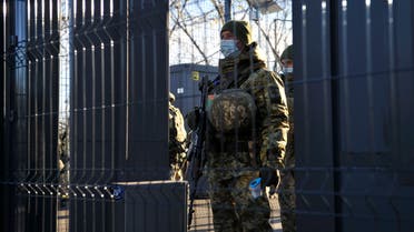 Ukrainian border guards secure the checkpoint between the Kiev-controlled territory and occupied ares in the war-torn east, in the town of Schastya in the Lugansk region on November 10, 2020. Ukraine opened on November 10, 2020, two new crossing points in the war-torn east but its attempt to facilitate the movement of civilians was hampered by separatists who denied passage to people. After a separatist uprising broke out in eastern Ukraine in 2014 and pro-Russian separatists carved out the Donetsk People's Republic and Lugansk People's Republic, travelling from and to Kiev-controlled territory has become a complicated affair. / AFP / Evgeniya MAKSYMOVA