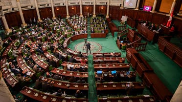 Tunisian lawmakers debate ahead of a confidence vote on the new government reshuffle by Prime Minister Hichem Michichi at the Tunisian Assembly (parliament) headquarters in the capital Tunis on January 26, 2021. / AFP / FETHI BELAID