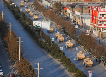 The exercise involved dozens of US-made M117 armoured security vehicles driving slowly up and down a major Kabul road with MI-17 helicopters patrolling overhead. (Reuters)