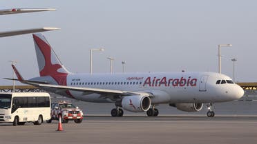 An Air Arabia Airbus A320 aircraft is seen taxiing at Qatar's Hamad International Airport near the capital Doha on January 18, 2021. (AFP)