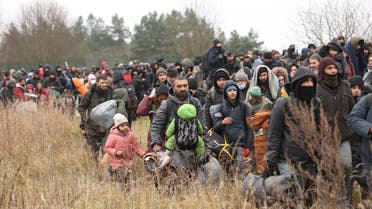 Migrants gather on the Belarusian-Polish border near the Polish border crossing in Kuznica, Nov. 15, 2021. (AFP)
