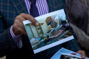 Dr. Izzeldin Abuelaish holds a photograph of his daughter’s room in Gaza as he sits inside Israel’s Supreme Court for a hearing on his demand for an apology and compensation in Jerusalem, Nov. 15, 2021. (AP/Ariel Schalit)