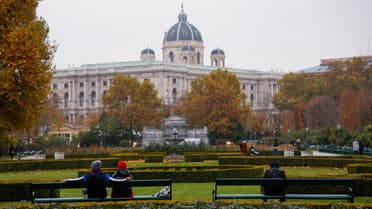 People sit in a public garden amidst the coronavirus disease (COVID-19) outbreak, as Austria's government imposes a lockdown on people who are not fully vaccinated, in Vienna, Austria November 14, 2021. REUTERS/Leonhard Foeger