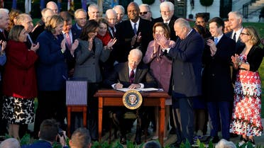 President Joe Biden signs the Infrastructure Investment and Jobs Act at the White House, Nov. 15, 2021. (AP)