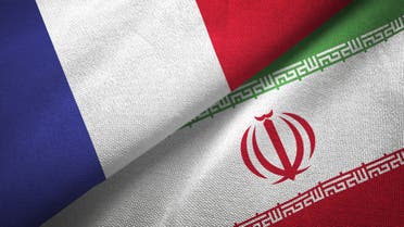 Iran and France two flags together realations textile cloth fabric texture stock photo