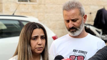 Israeli couple Mordi and Natali Oknin speak to the media following their release and arrival in Modiin, Israel November 18, 2021. (Reuters)