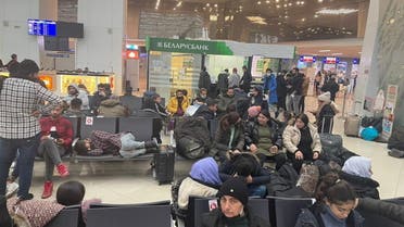 Iraqi migrants wait for evacuation flight at Minsk airport, Belarus November 18, 2021. Iraqi Foreign Ministry media office/Handout via REUTERS ATTENTION EDITORS - THIS IMAGE WAS PROVIDED BY A THIRD PARTY.