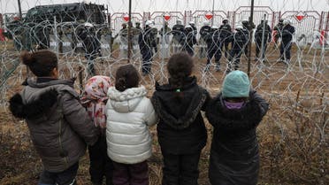 Migrants aiming to cross into Poland camp near the Bruzgi-Kuznica border crossing on the Belarusian-Polish border on November 17, 2021. (AFP)
