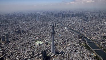 This aerial photo shows Tokyo skyline and Tokyo Skytree as the city prepares to host the 2020 Olympic Games, in Tokyo on July 19, 2021. (AFP)