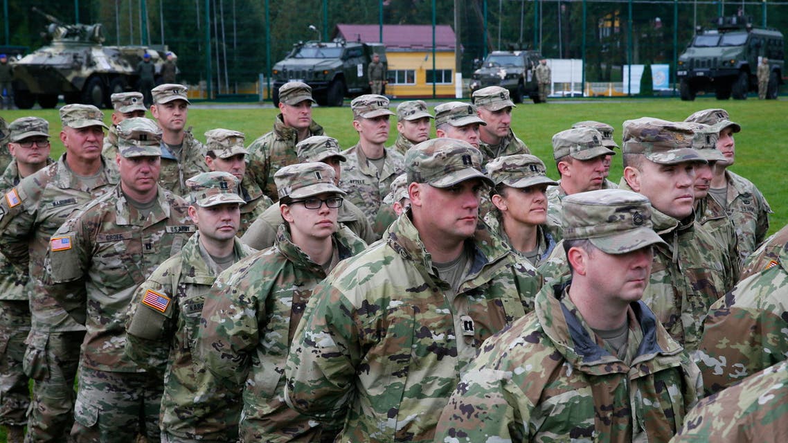 Servicemen of the U.S. and Ukrainian armies attend the opening ceremony of the RAPID TRIDENT-2021 military exercise at Ukraine's International Peacekeeping Security Centre near Yavoriv in the Lviv region, Ukraine September 20, 2021. REUTERS/Gleb Garanich