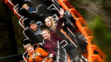 People react as they visit Hellendoorn theme park, as part of an experiment by the government to test how the tourism, hospitality and culture sectors could open up again after the coronavirus disease (COVID-19) lockdown restrictions, in Hellendoorn, Netherlands April 10, 2021. (File photo: Reuters)