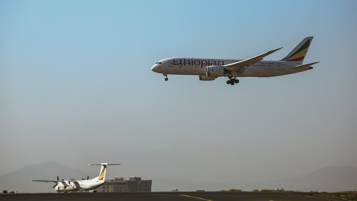 A picture taken on March 7, 2021 shows an airplane of Ethiopian airlines delivering boxes of Oxford/AstraZeneca Covid-19 vaccines, as a part of the UN-led Covax initiative which is working to facilitate vaccine access for poorer countries, at Addis Ababa international airport, Ethiopia, on March 7, 2021. Ethiopia on March 7, 2021 received its first 2.2 million doses of vaccine against the coronavirus, and officials in Africa's second most populous country said the first jabs would be administered in the coming days. (Photo by Amanuel SILESHI / AFP)