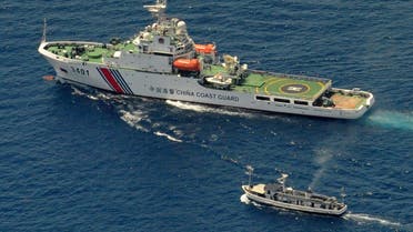 This file photo taken on March 19, 2014 shows a China Coast Guard ship (top) and a Philippine supply boat engaging in a stand off as the Philippine boat attempts to reach the Second Thomas Shoal, a remote South China Sea a reef claimed by both countries. (AFP)