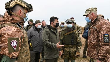 Ukrainian President Volodymyr Zelenskiy meets with service members in the Kherson Region bordering the Crimean peninsula annexed by Russia April 27, 2021. (Reuters)