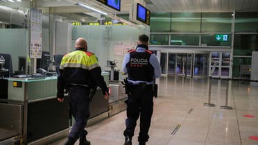 Police officers patrol at Josep Tarradellas Barcelona-El Prat Airport, in Barcelona, Spain, November 19, 2021. (Reuters)