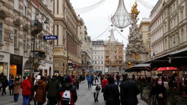 Pedestrians walk along a shopping street after the Austrian government placed roughly two million people who are not fully vaccinated against the coronavirus disease (COVID-19) on lockdown, in Vienna, Austria, November 17, 2021. (Reuters)