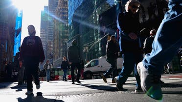 People walk through Times Square during the (COVID-19) pandemic in the Manhattan borough, Nov. 10, 2021. (Reuters)
