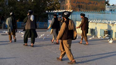 Taliban fighters walk at the courtyard of the Hazrat-e-Ali shrine or Blue Mosque, in Mazar-i-Sharif on October 30, 2021. (Photo by WAKIL KOHSAR / AFP)
