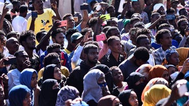 People take part in a funeral procession for a Sudanese protester in the capital Khartoum on November 20, 2021. (AFP)