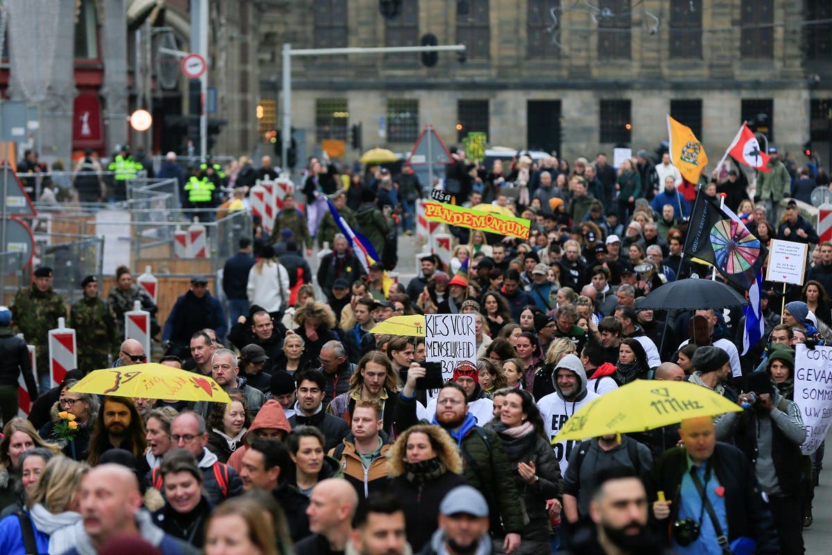People protest during demonstrations against coronavirus disease (COVID-19) measures in Amsterdam, Netherlands, on November 20, 2021. (Reuters)