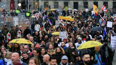People protest during demonstrations against coronavirus disease (COVID-19) measures in Amsterdam, Netherlands, on November 20, 2021. (Reuters)