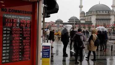 People stand outside a currency exchange office in Istanbul, Turkey November 23, 2021. (Reuters)