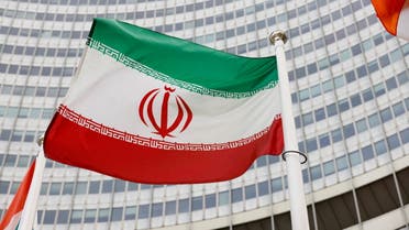 FILE PHOTO: The Iranian flag waves in front of the International Atomic Energy Agency (IAEA) headquarters in Vienna, Austria May 23, 2021. REUTERS/Leonhard Foeger/File Photo